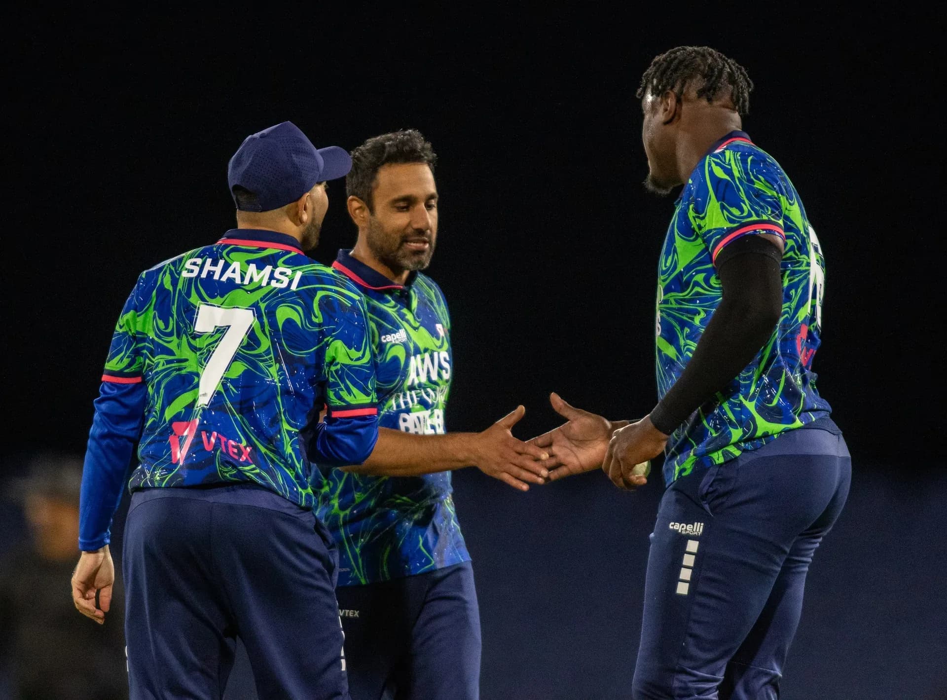 Live match action — night cricket